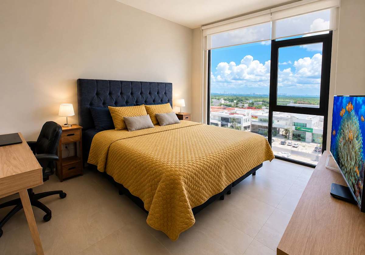 Bedroom with king bed and lagoon view