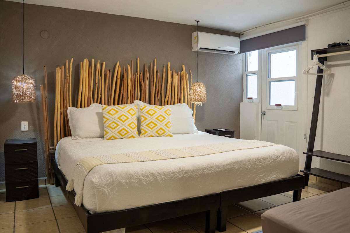 Comfortable studio bedroom with a king bed and cool A/C, a restful base in downtown Cancun