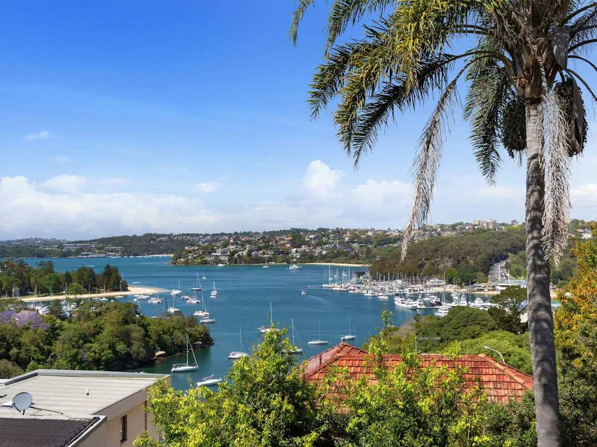 Elevated exterior view of the property showcasing water views and surrounding greenery.