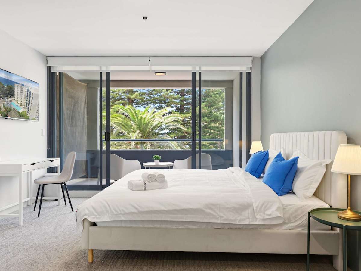 Bright bedroom with large window