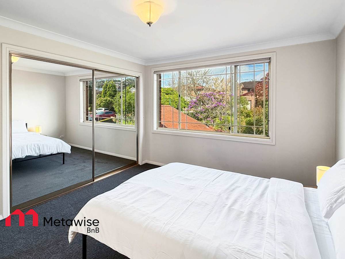 Bright bedroom with mirrored wardrobe