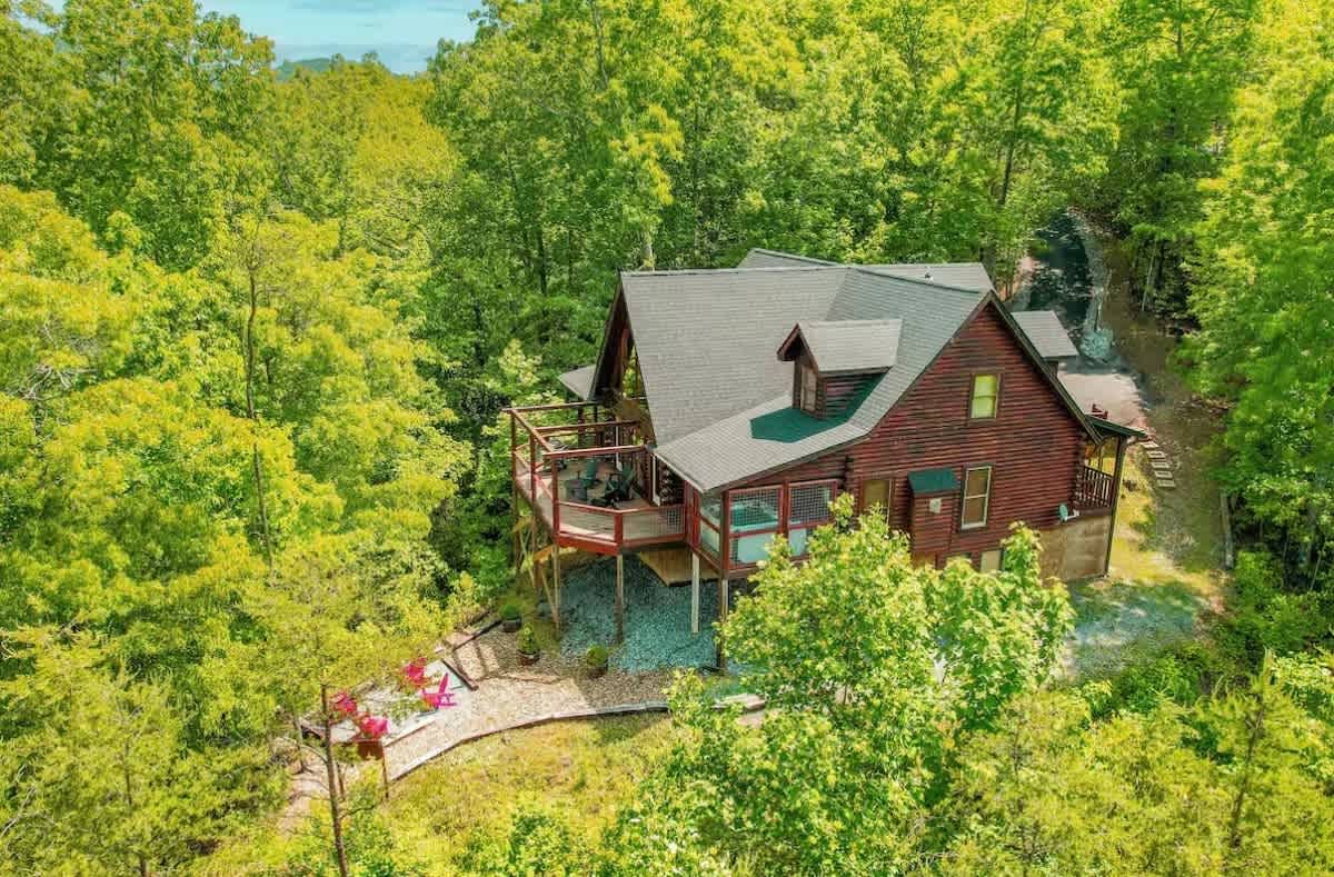 Luxury Cabin w/ Private Waterfall & Hot Tub photo 1