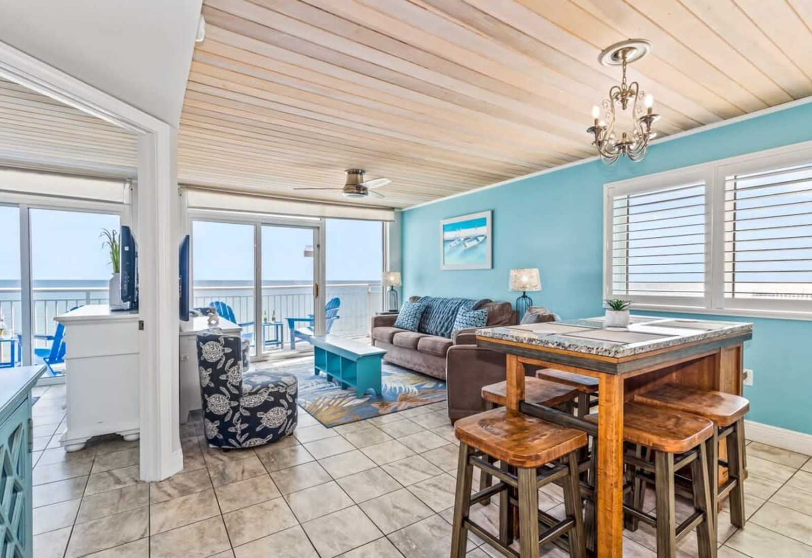 Dine in style in this vibrant and spacious dining area, complete with colorful coastal accents and seating for everyone. 