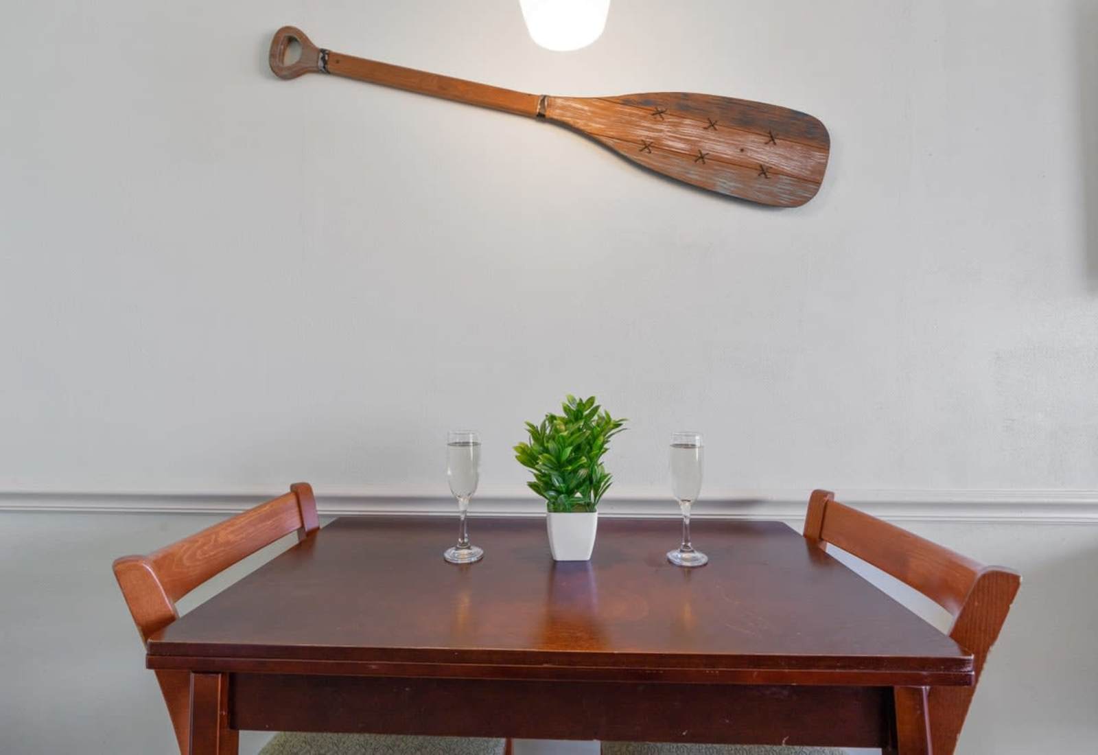 Toast to beach days and breezy nights at this charming dining nook—complete with coastal flair and just enough space for shared laughter, seafood feasts, and that second glass of bubbly.