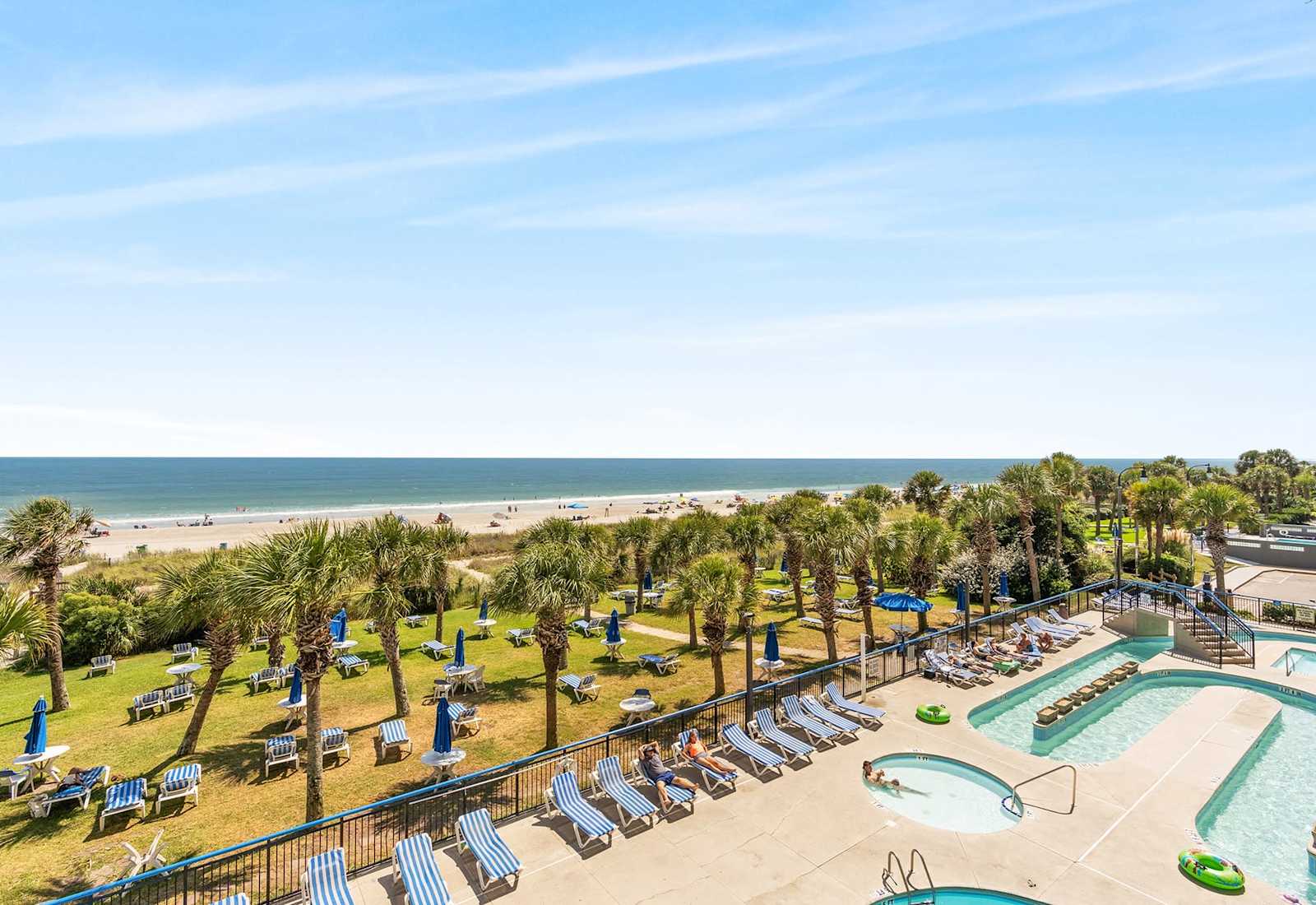 Take in the breathtaking panoramic view of the ocean and the resort's lush landscape from your balcony. 
