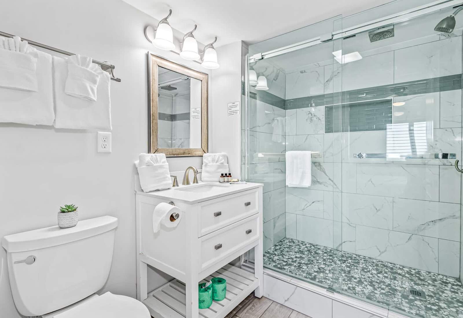 Freshen up in this sparkling clean bathroom featuring a sleek granite countertop, modern fixtures, and a full shower/tub combo. Stocked with essentials to ensure a relaxing and hassle-free stay!