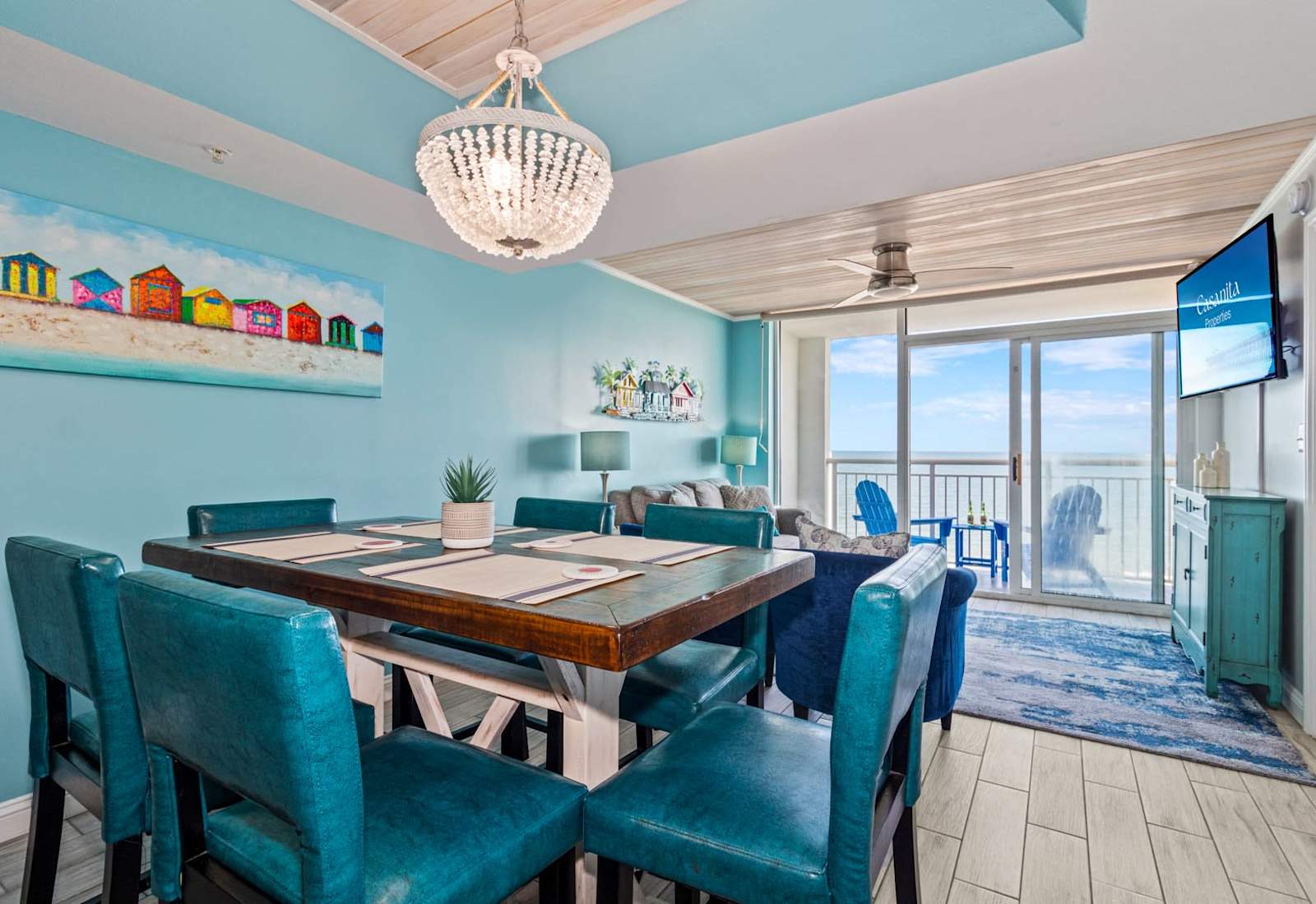 Dine in style in this vibrant and spacious dining area, complete with colorful coastal accents and seating for everyone. Enjoy meals while soaking up natural light and ocean views, creating the perfect setting for memorable gatherings.
