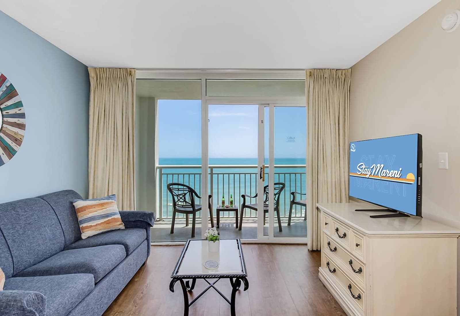 Bask in breathtaking ocean views from this charming living room, featuring a plush sofa, chic décor, and a private balcony.