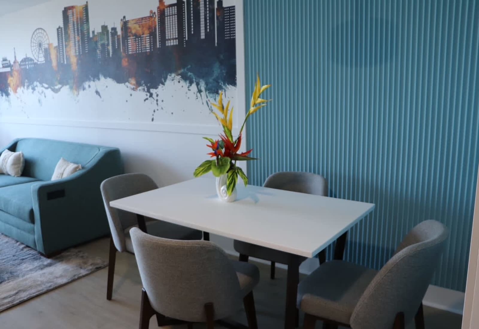 Gather around the table for meals, games, or planning your beach adventures in this stylish dining area featuring designer seating and modern coastal décor.