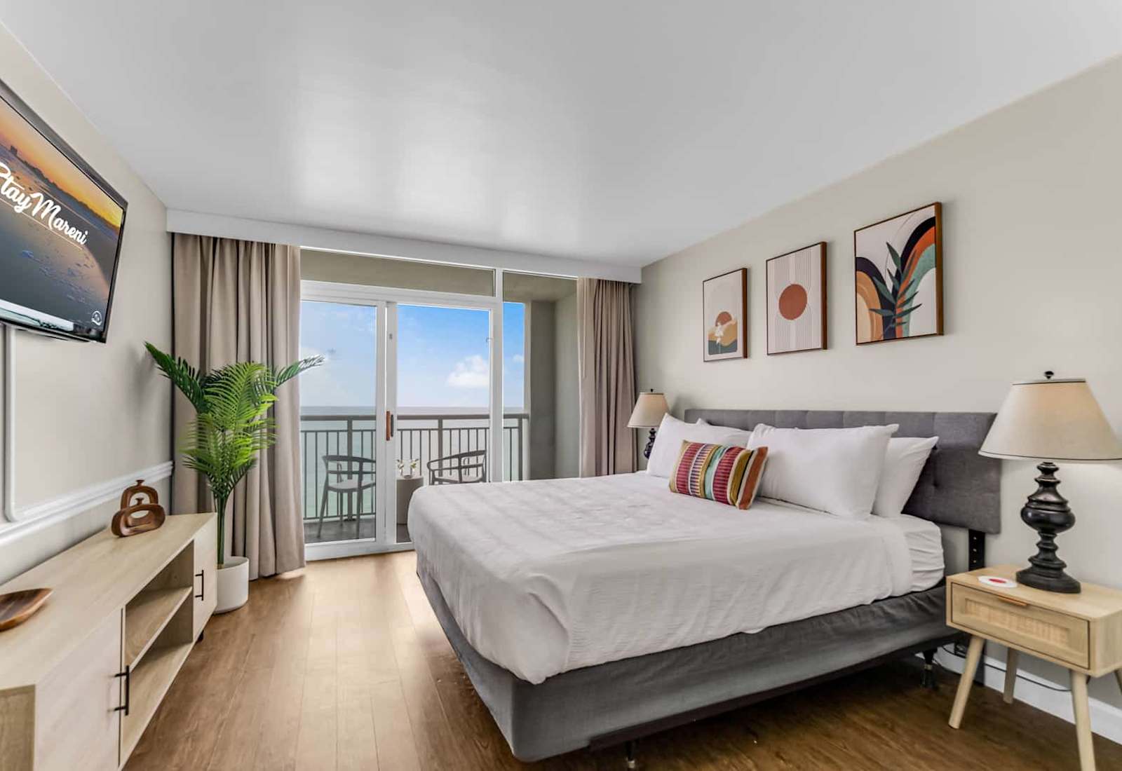 Wake up to breathtaking ocean views in this serene bedroom featuring a plush king-sized bed, stylish décor, and private balcony access. Relax, unwind, and enjoy the ultimate coastal retreat.