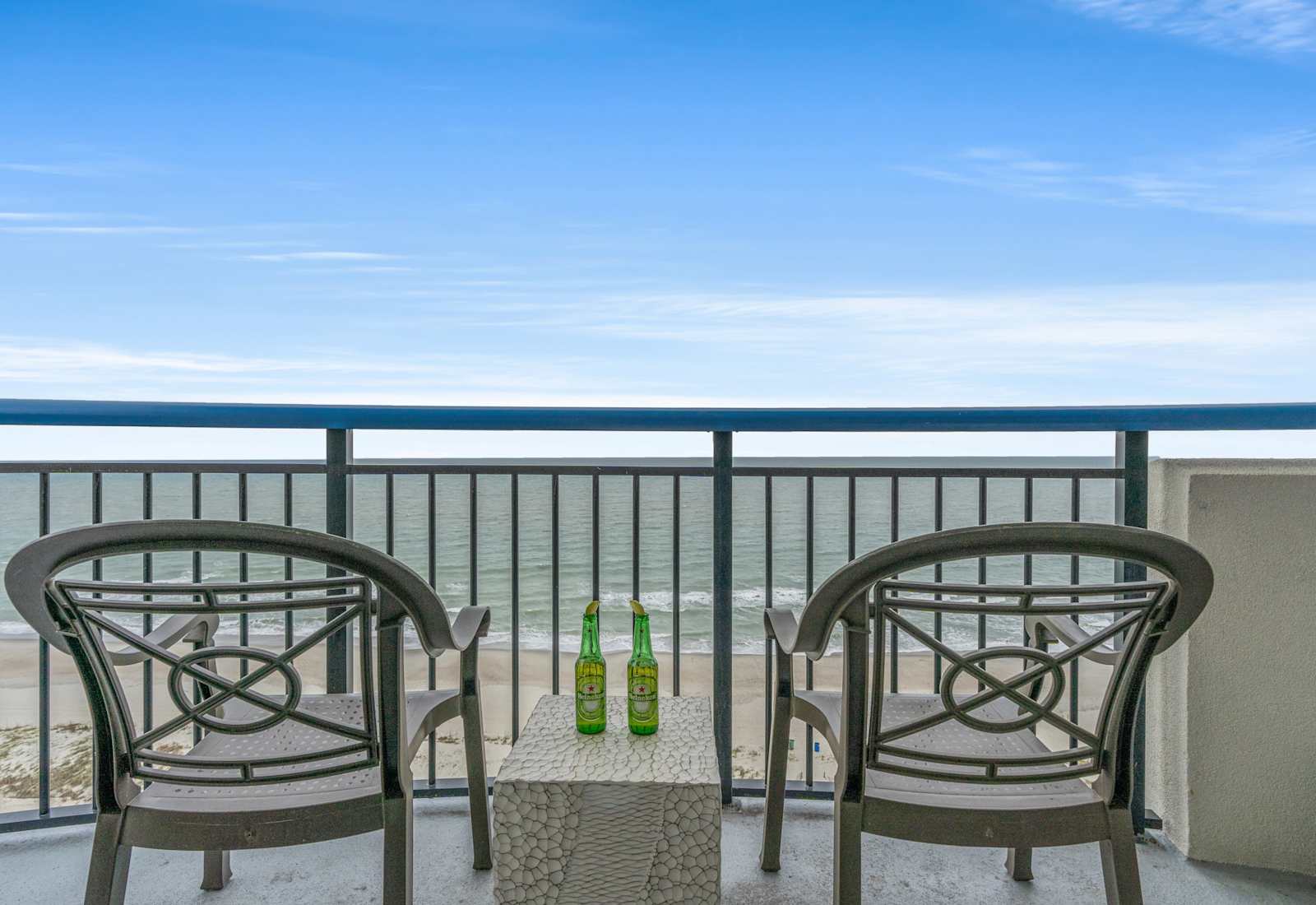 Enjoy stunning ocean views from your private balcony, perfect for relaxing with a drink. 
