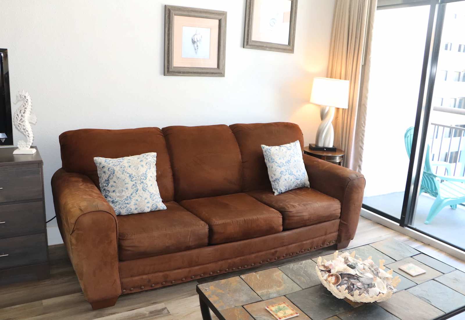 Open-concept studio living space featuring a pull out sofa sleeper for additional guests.