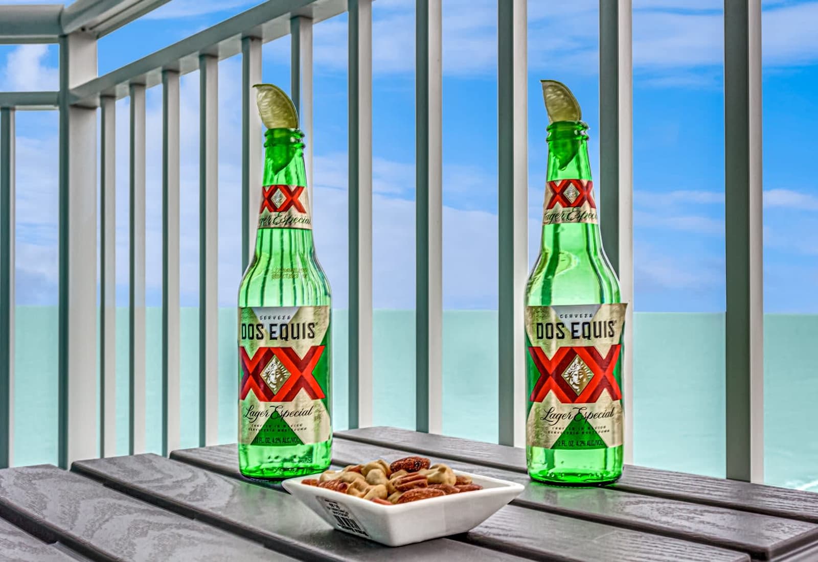 Relax on the balcony with a drink and light snacks while taking in calming ocean views just beyond the railing.