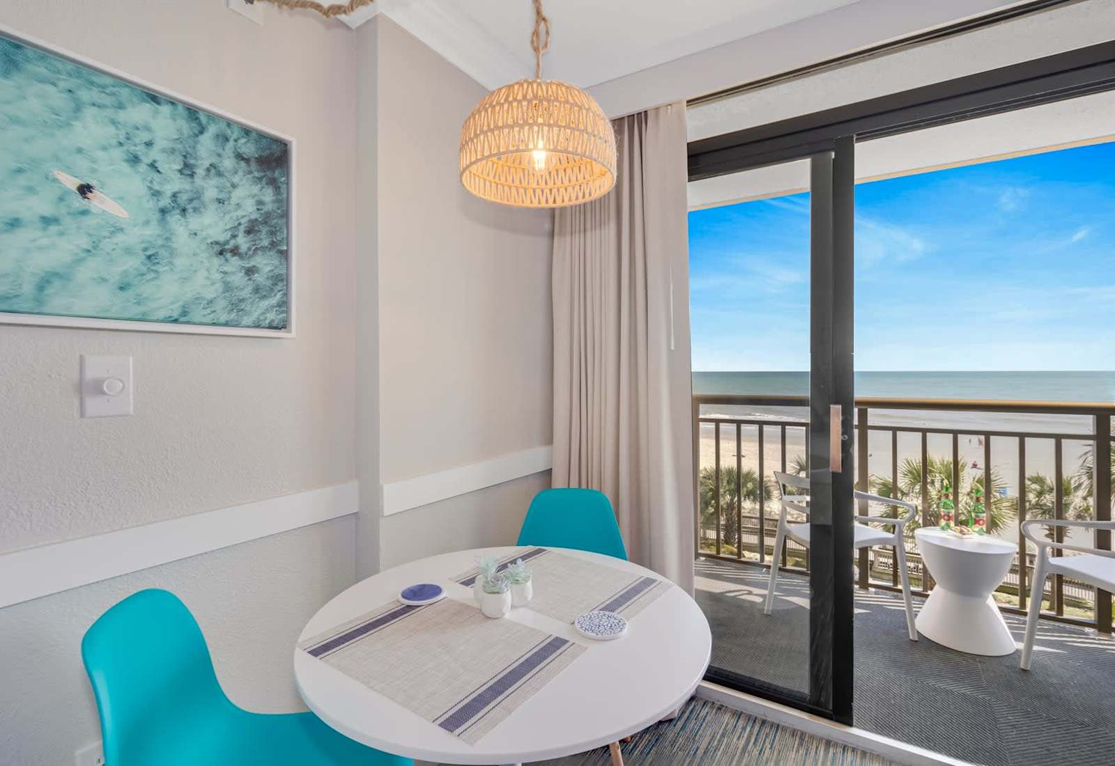 Cozy dining area with ocean views, perfect for enjoying meals with a breathtaking backdrop. Relax and unwind in this bright, inviting space!