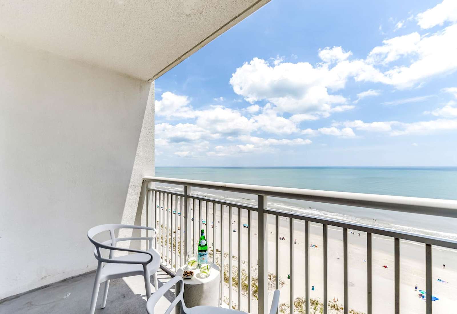 Relax on your private balcony with sweeping ocean views. The perfect spot to sip, savor, and soak up the serene beach vibes.
