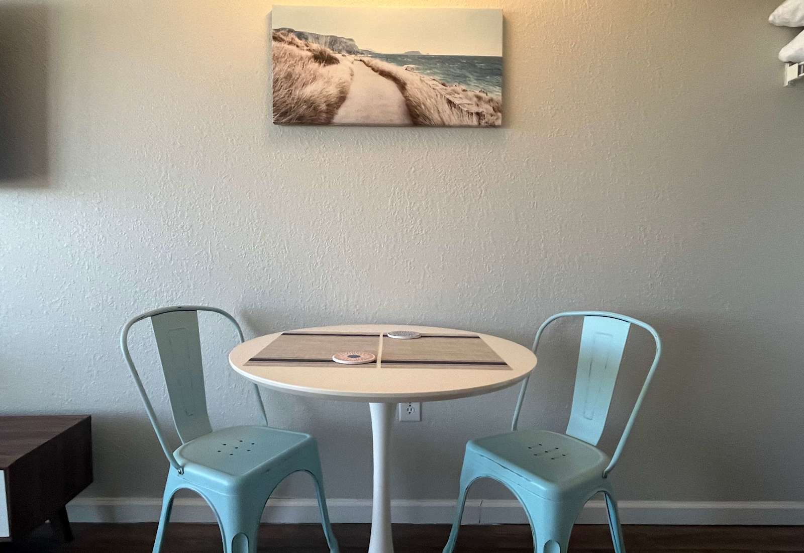 Enjoy your meals at our cozy dining table, perfect for intimate dinners or morning coffee.