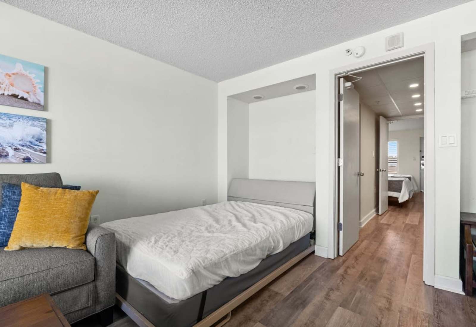 Extra comfort meets convenience with this cozy pull-out bed—perfect for additional guests or family members, offering a restful night’s sleep in a bright and welcoming coastal space.
