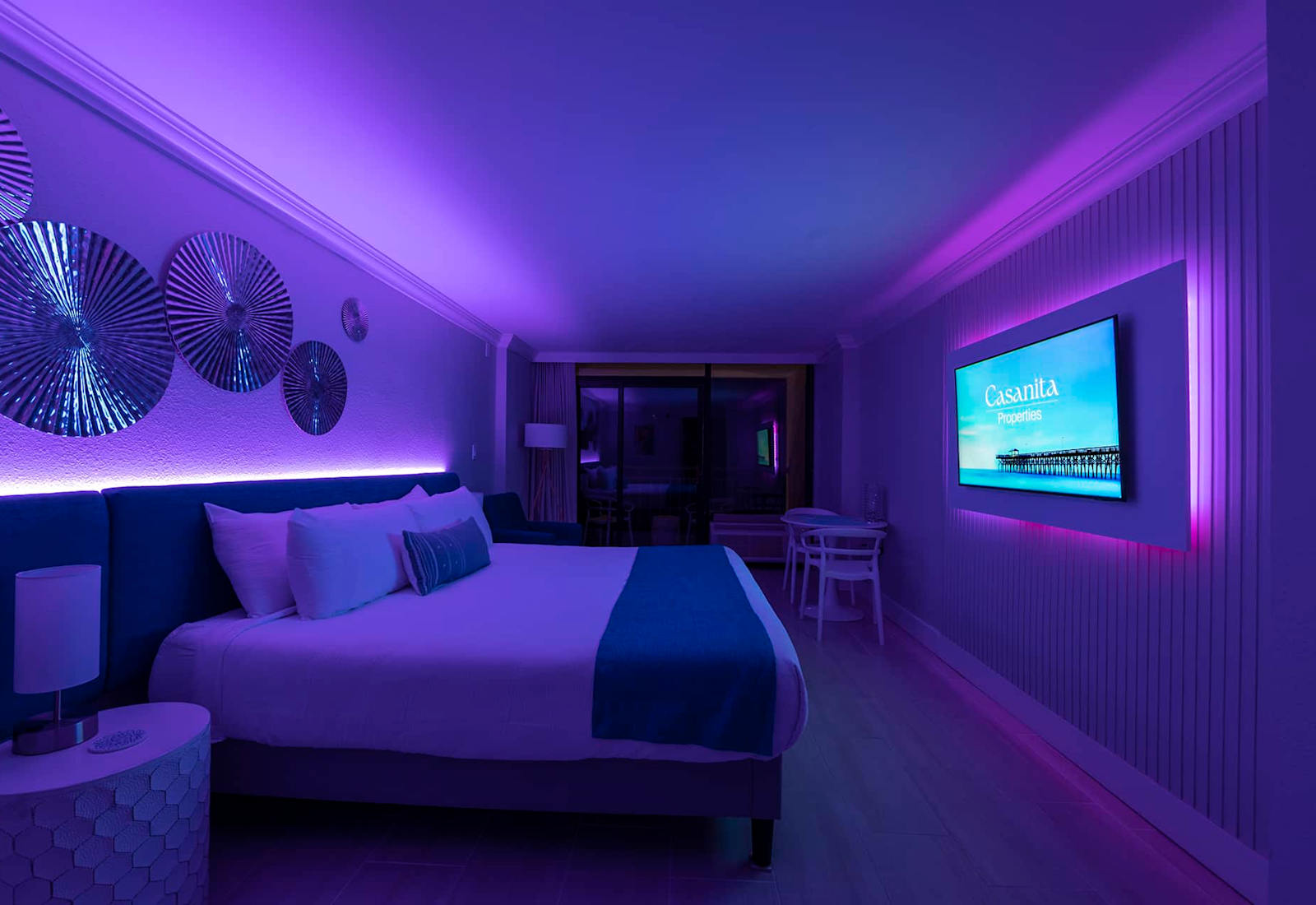 Relax in a modern and stylish room with customizable mood lighting.