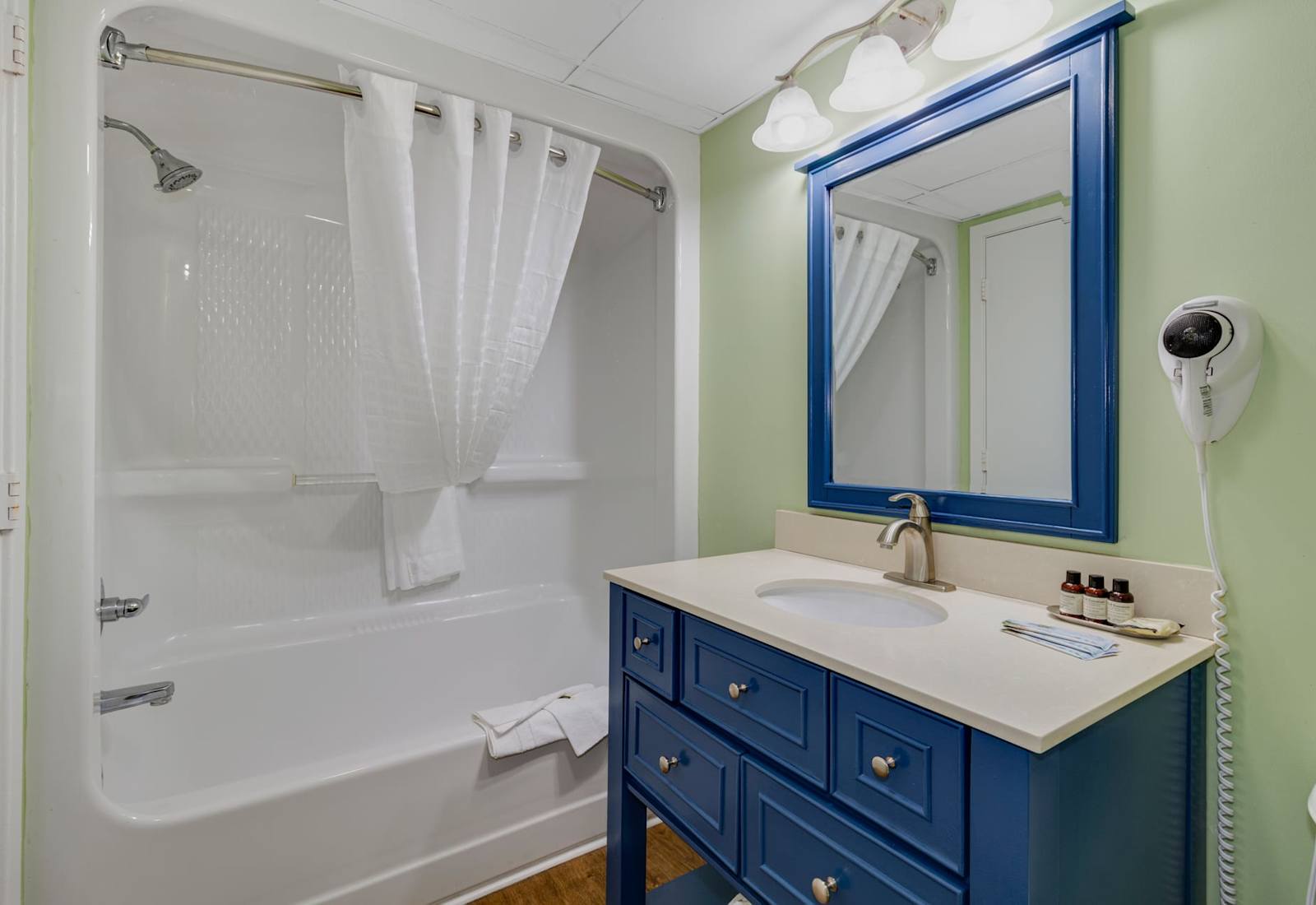 Freshen up in this charming and functional bathroom, complete with modern fixtures, soft lighting, and coastal-inspired accents. Conveniently located near the living area and balcony, it’s designed to complement your relaxing beachside getaway
