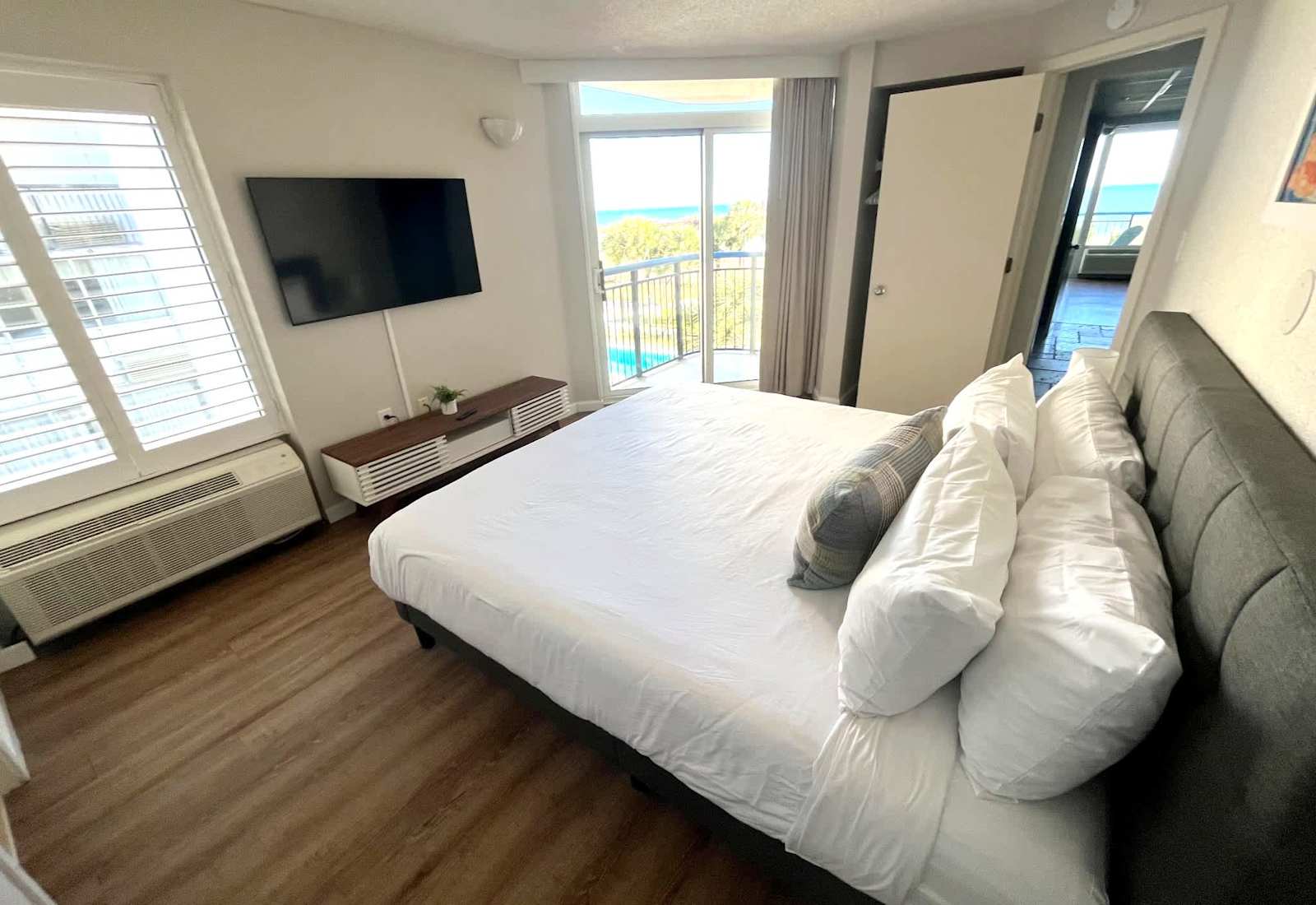 Drift off to sleep in our cozy and inviting bedroom, featuring a comfortable bed, soft linens, and a private balcony. 