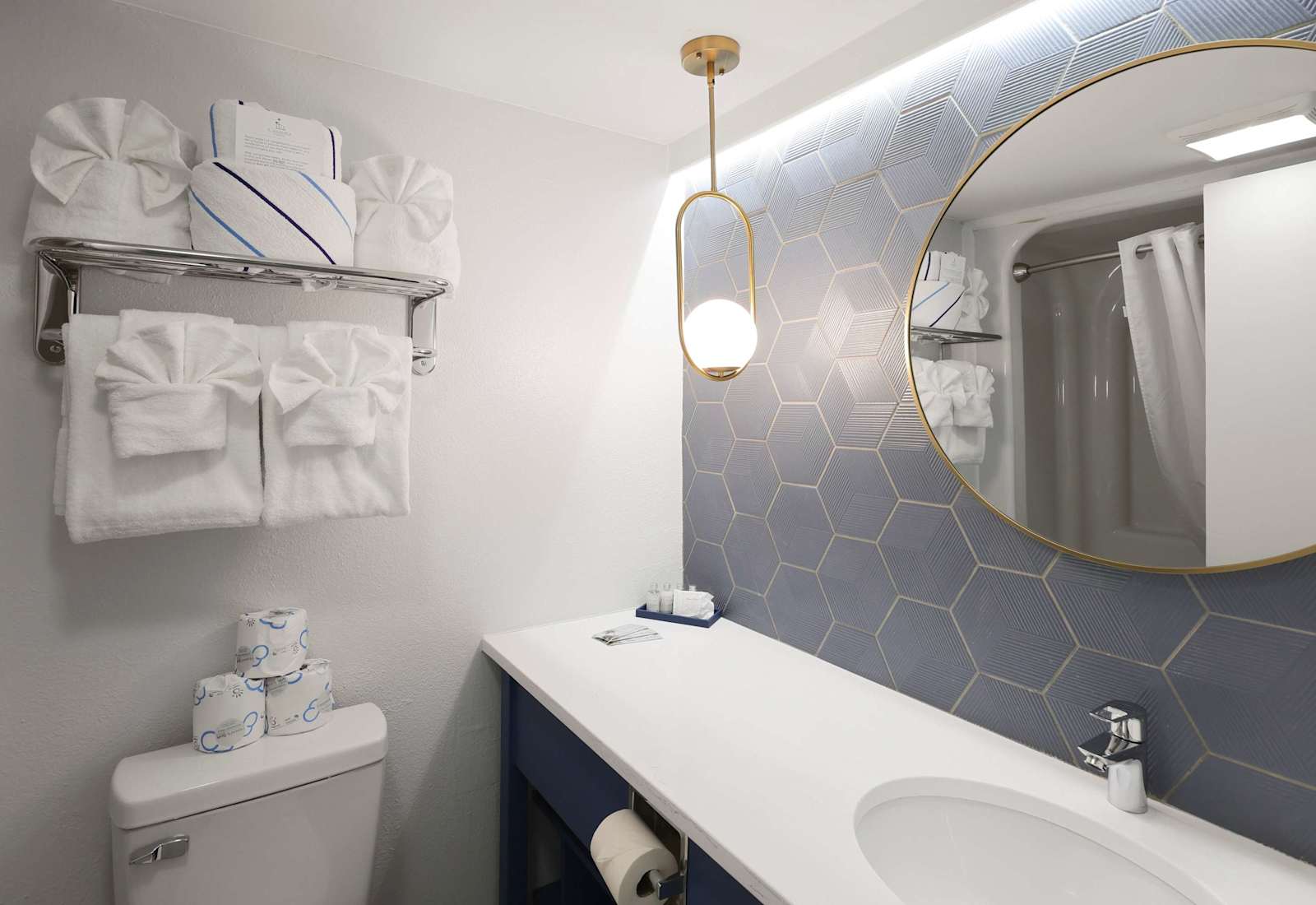 Fresh, clean, and thoughtfully stocked, this bathroom offers plush towels, a spacious vanity, and a tub-shower combo—everything you need to refresh after a day of sun, sand, and seaside fun.