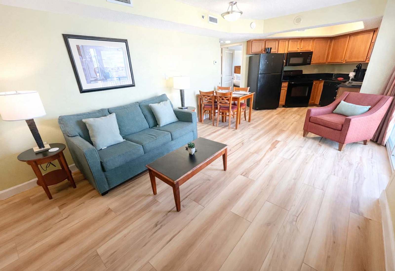 Cozy suite with a full kitchen, dining space, and comfortable seating, perfect for relaxing and unwinding.