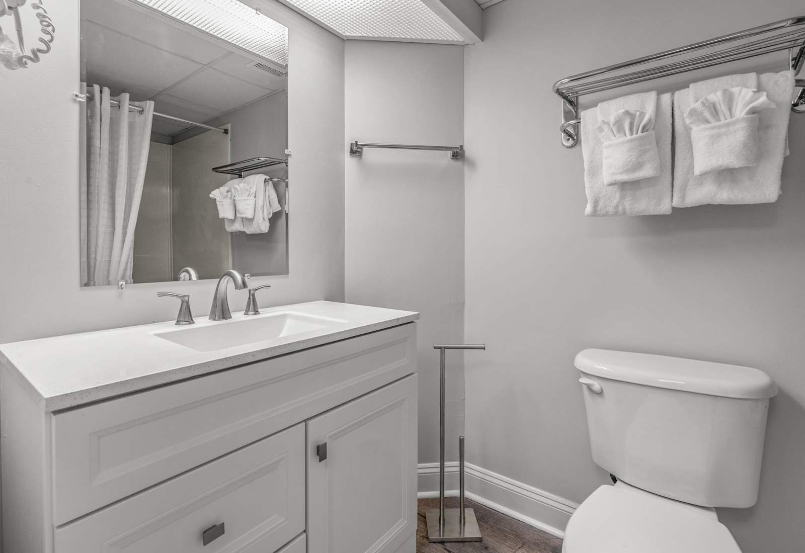 Relax and unwind in the clean and modern bathroom with a shower/tub combo and granite countertop vanity. 
