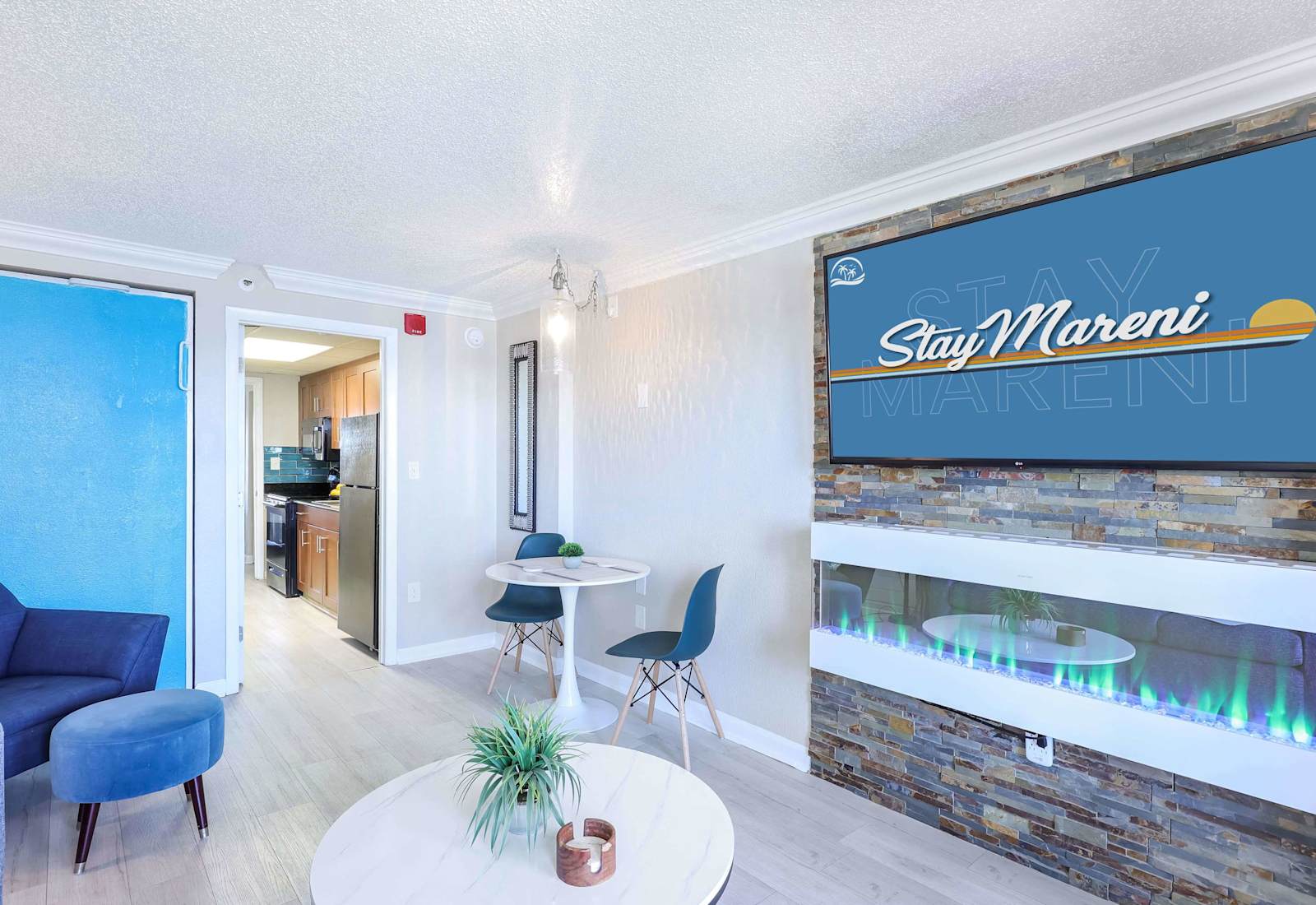 Modern comfort meets coastal charm in this inviting living space, featuring a smart TV, cozy fireplace, and a stylish dining nook. The perfect spot to relax after a beach day or enjoy a quiet night in with your favorite shows.