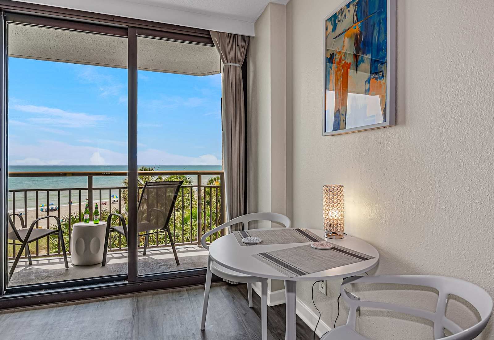 Enjoy morning coffee or sunset snacks at this cozy dining spot with stunning ocean views. A peaceful space to relax, recharge, and take in the beauty of the beach right outside your door.