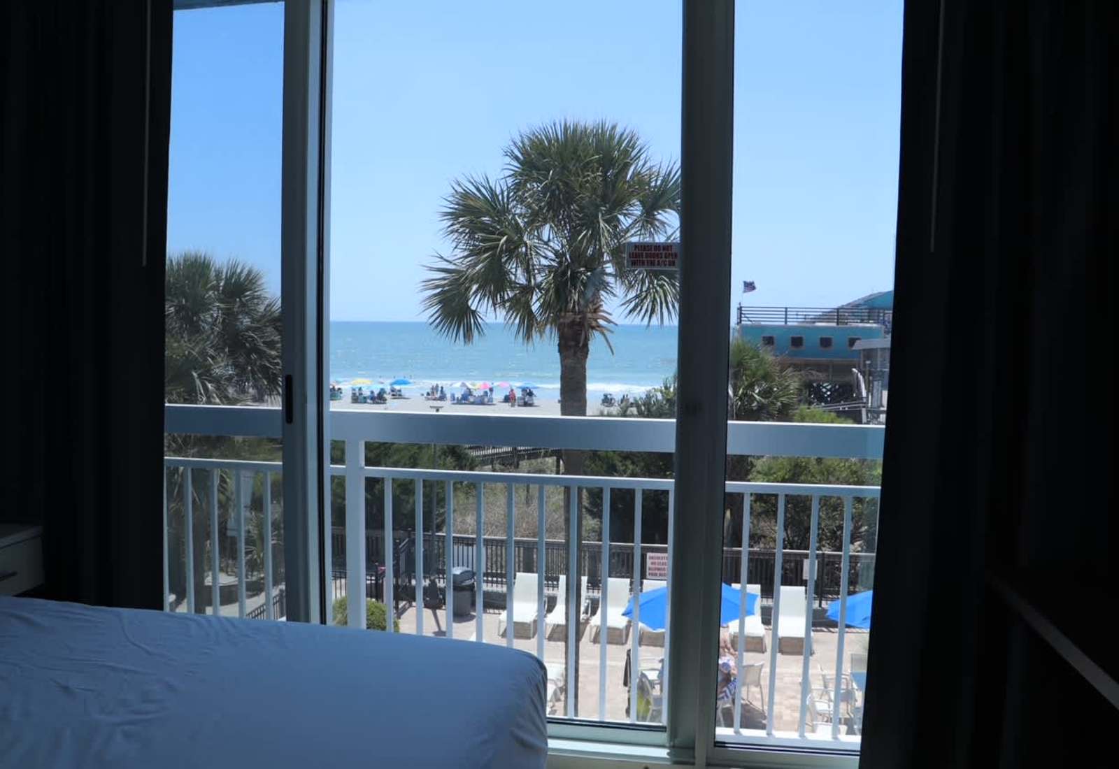 Enjoy beautiful ocean and palm tree views straight through the large sliding glass doors!