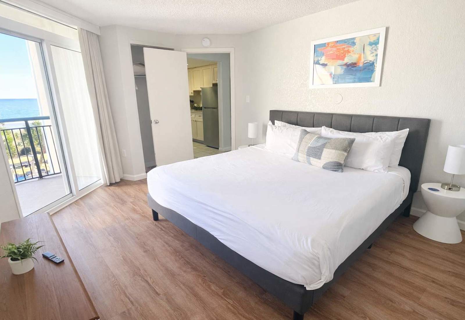 Drift off to sleep to the sound of the waves in our comfortable bedroom, featuring a king-size bed and stunning ocean views.