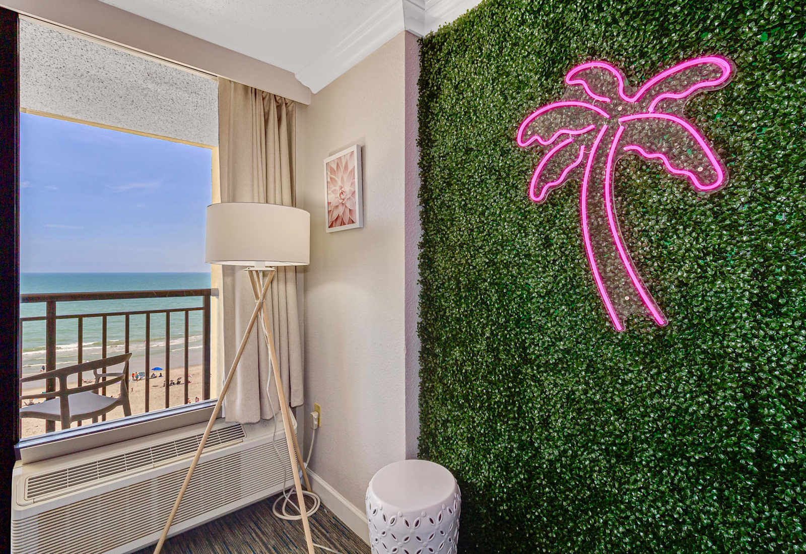 Relax in a stylish and modern room with a touch of tropical flair. 
