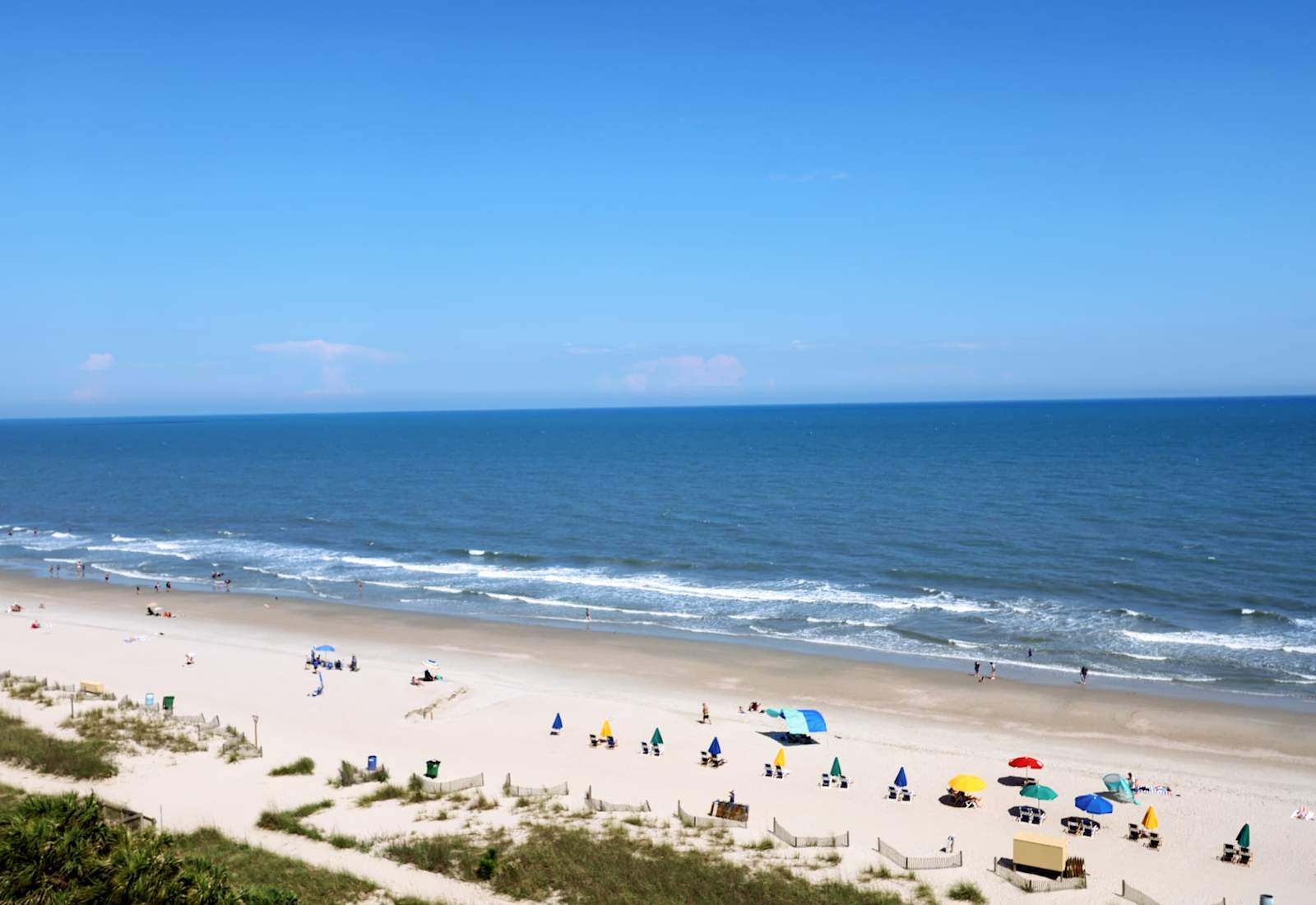 Standing on the beach, soft sand beneath your feet, you gaze out at endless blue waves meeting the horizon. The ocean breeze brushes your skin, the sun warms your face, and the sound of surf brings instant calm. It’s peaceful, vast, and unforgettable