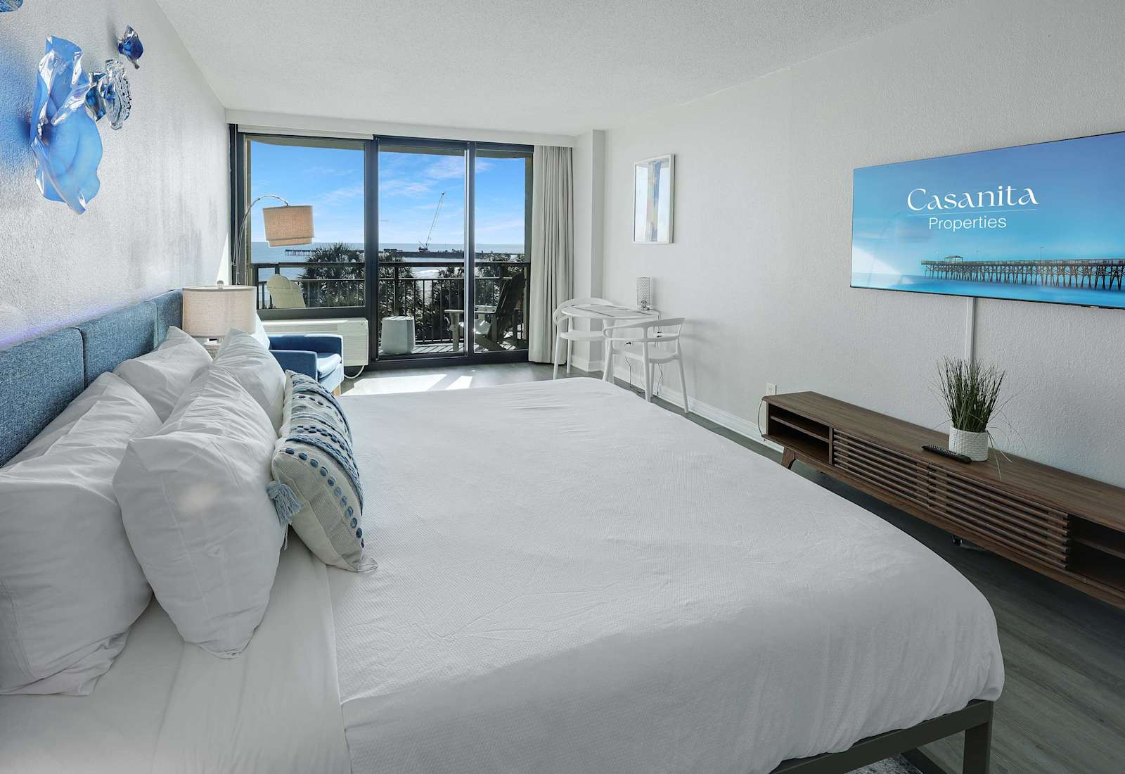 Wake up to blue skies and ocean breezes in this beautifully designed room with modern finishes, a flat-screen TV, and a bright, inviting workspace by the balcony.