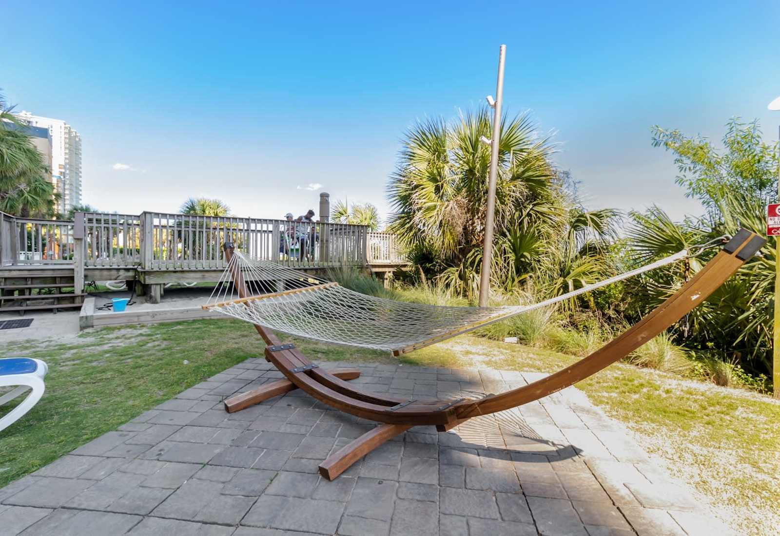 Relax in style on this cozy hammock, surrounded by lush greenery and peaceful vibes. Whether you're unwinding after a day at the beach or enjoying a serene moment, this spot is the perfect place to relax. 