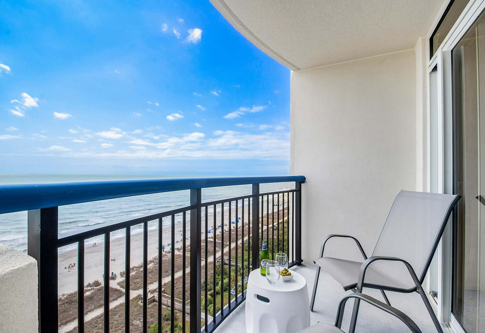  Wake up to stunning sunrise views from your private balcony. Relax in cozy chairs, sip your morning coffee, and soak in the breathtaking coastal scenery.