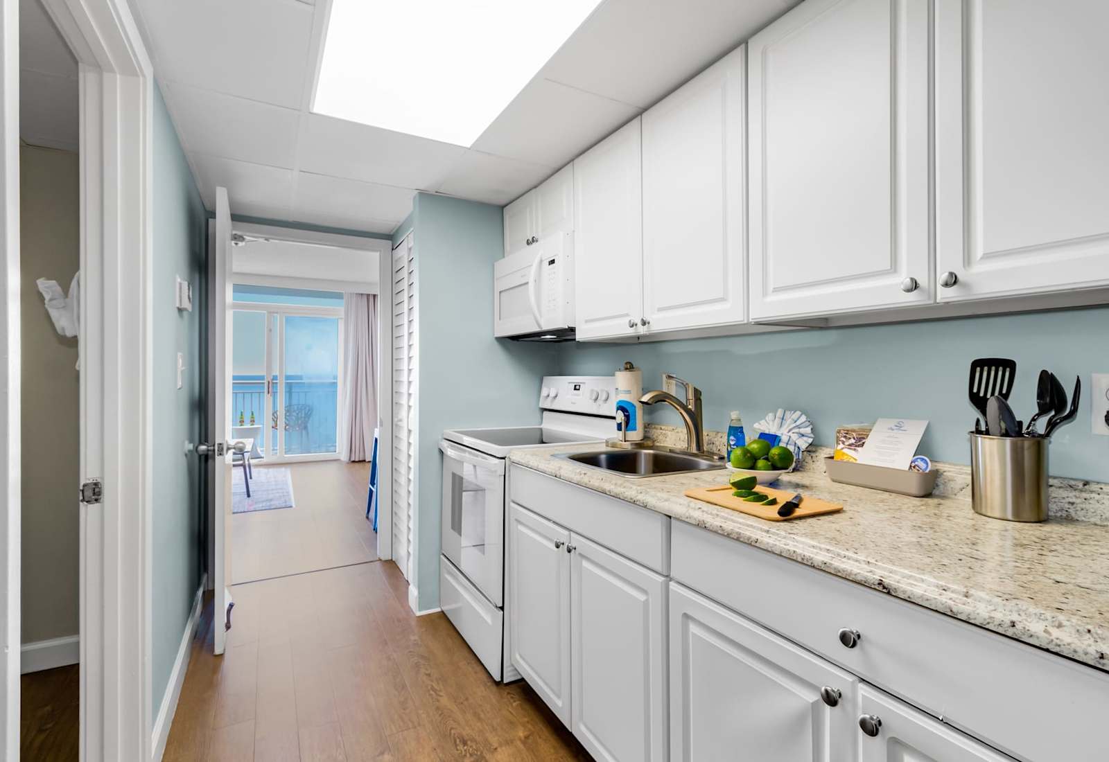Cook up delicious meals in this fully equipped kitchen featuring granite countertops, modern appliances, and plenty of cabinet space. Whether it's a quick breakfast or a gourmet dinner, this space has everything you need!