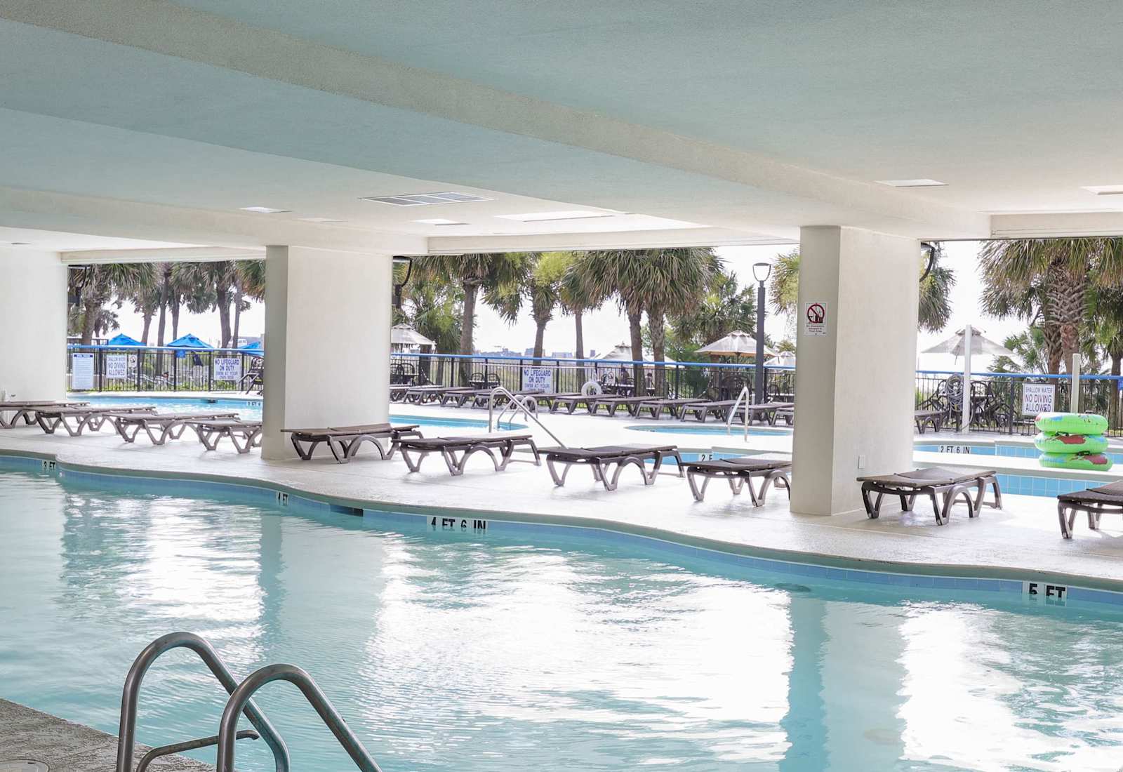 Rain or shine, dive into fun! Enjoy the best of both worlds with our indoor-outdoor pool—perfect for cooling off, relaxing, or floating the day away under the palms