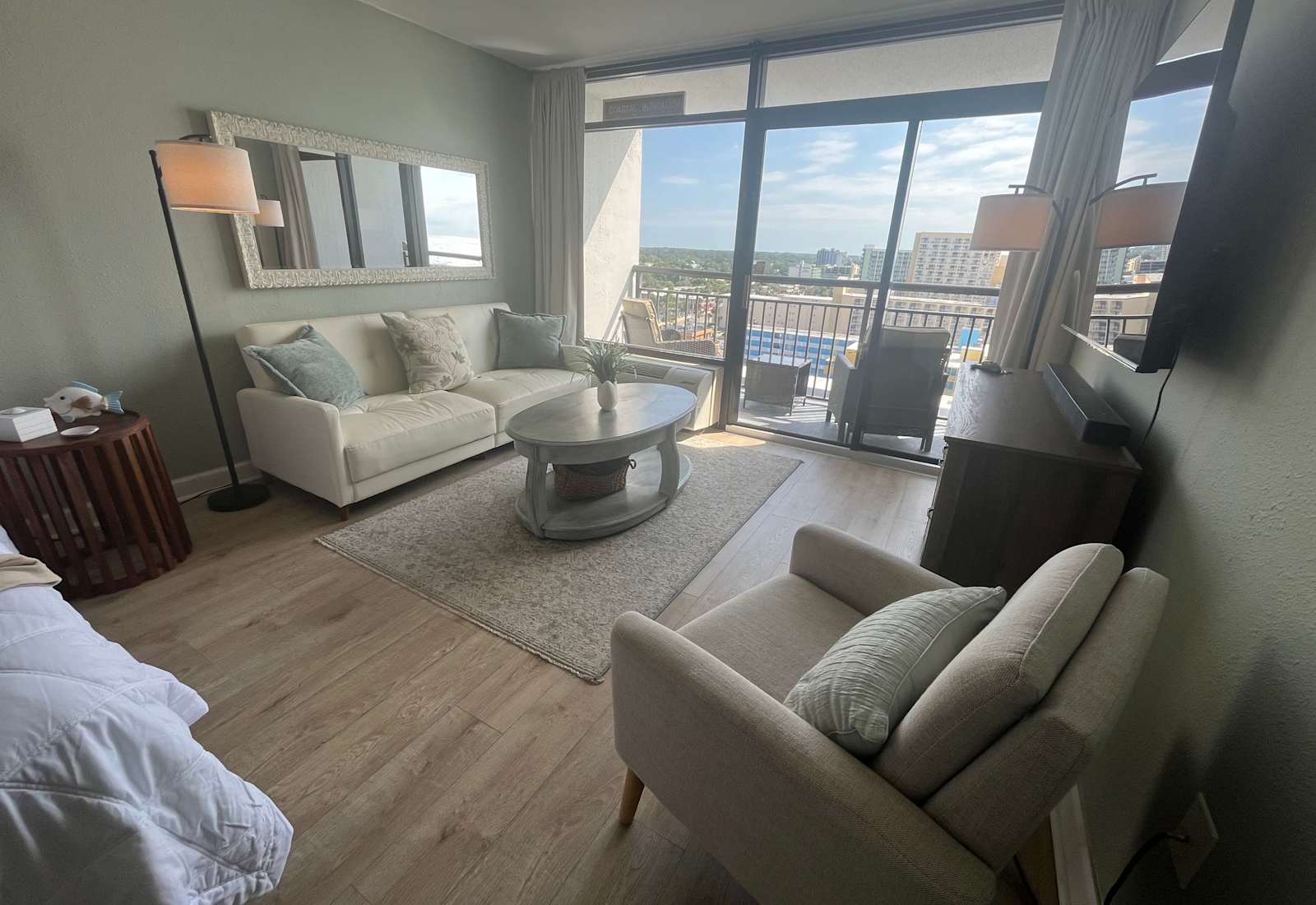 Bright coastal comfort with private balcony views.
