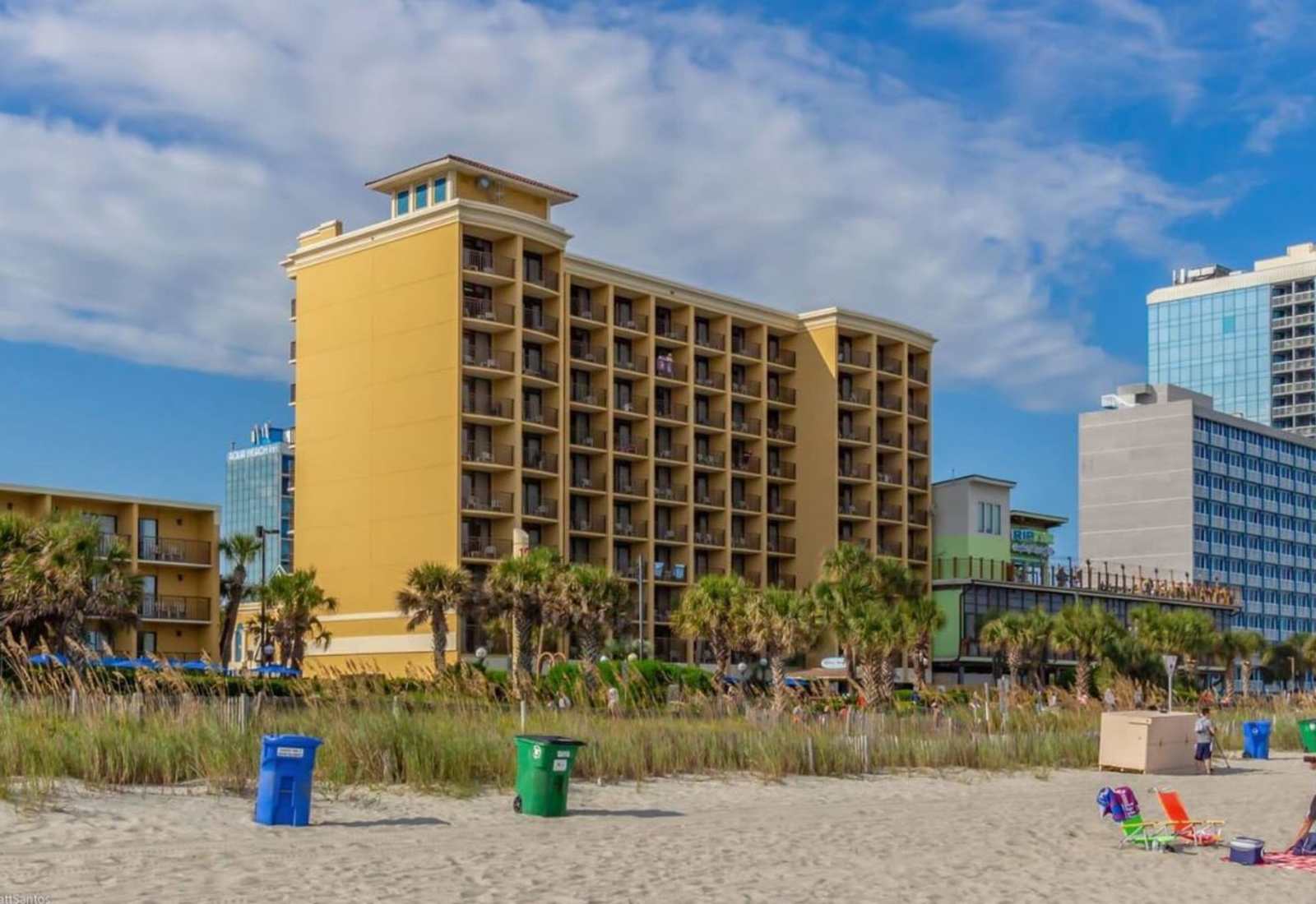 Enjoy stunning ocean views from the balcony of this spacious and modern hotel room.