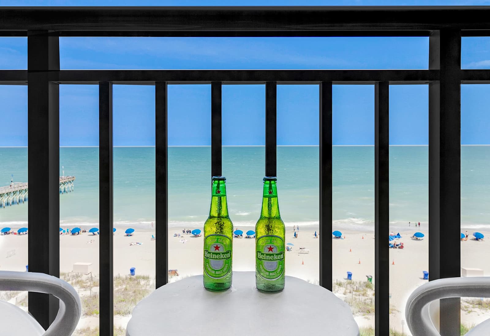 Enjoy stunning ocean views from your private balcony, complete with cozy seating to relax and take in the sights of the beach. Perfect for morning coffee or sunset evenings!