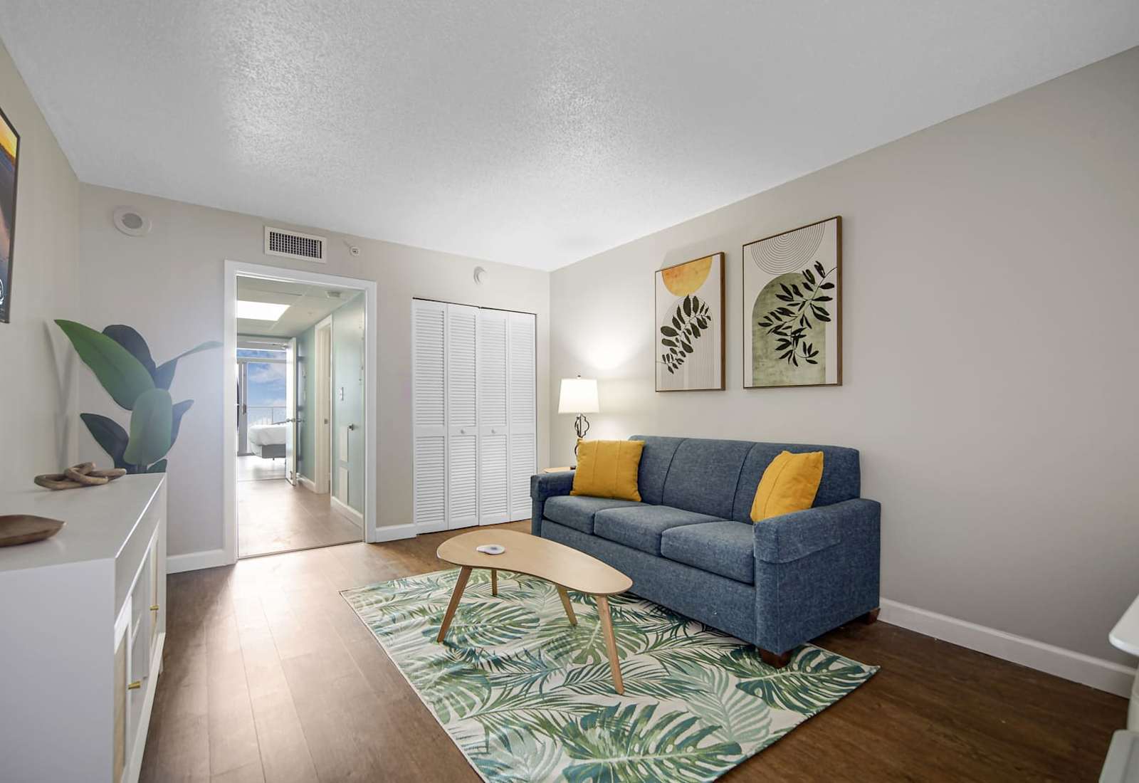 Unwind in this stylish living space featuring a comfy sofa, vibrant accents, and tropical-inspired décor. Perfect for cozy evenings or relaxing after a day of adventure, this room offers the ultimate retreat.