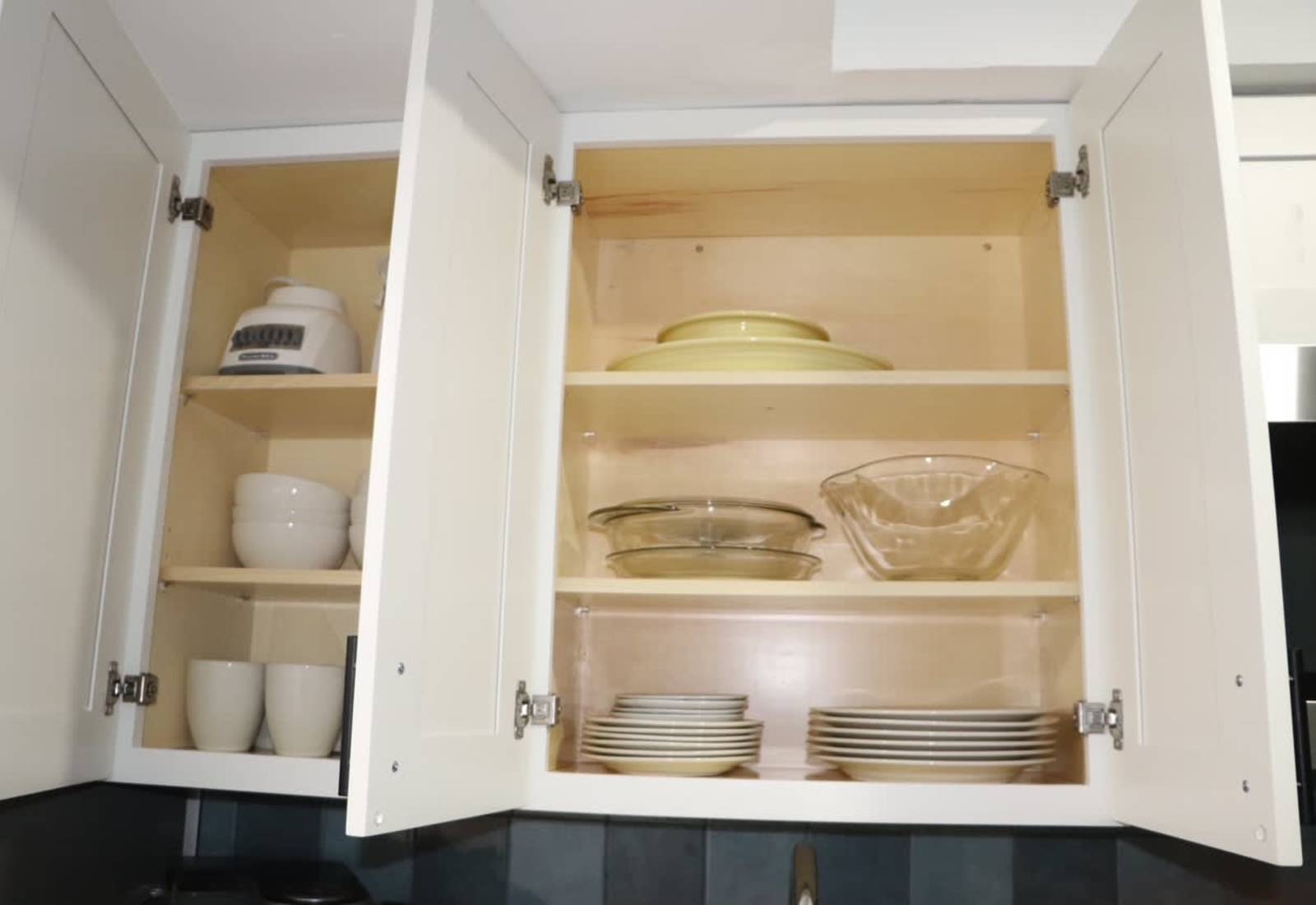 Find all the essential plates, bowls, and glassware you need in our fully stocked kitchen cabinets!