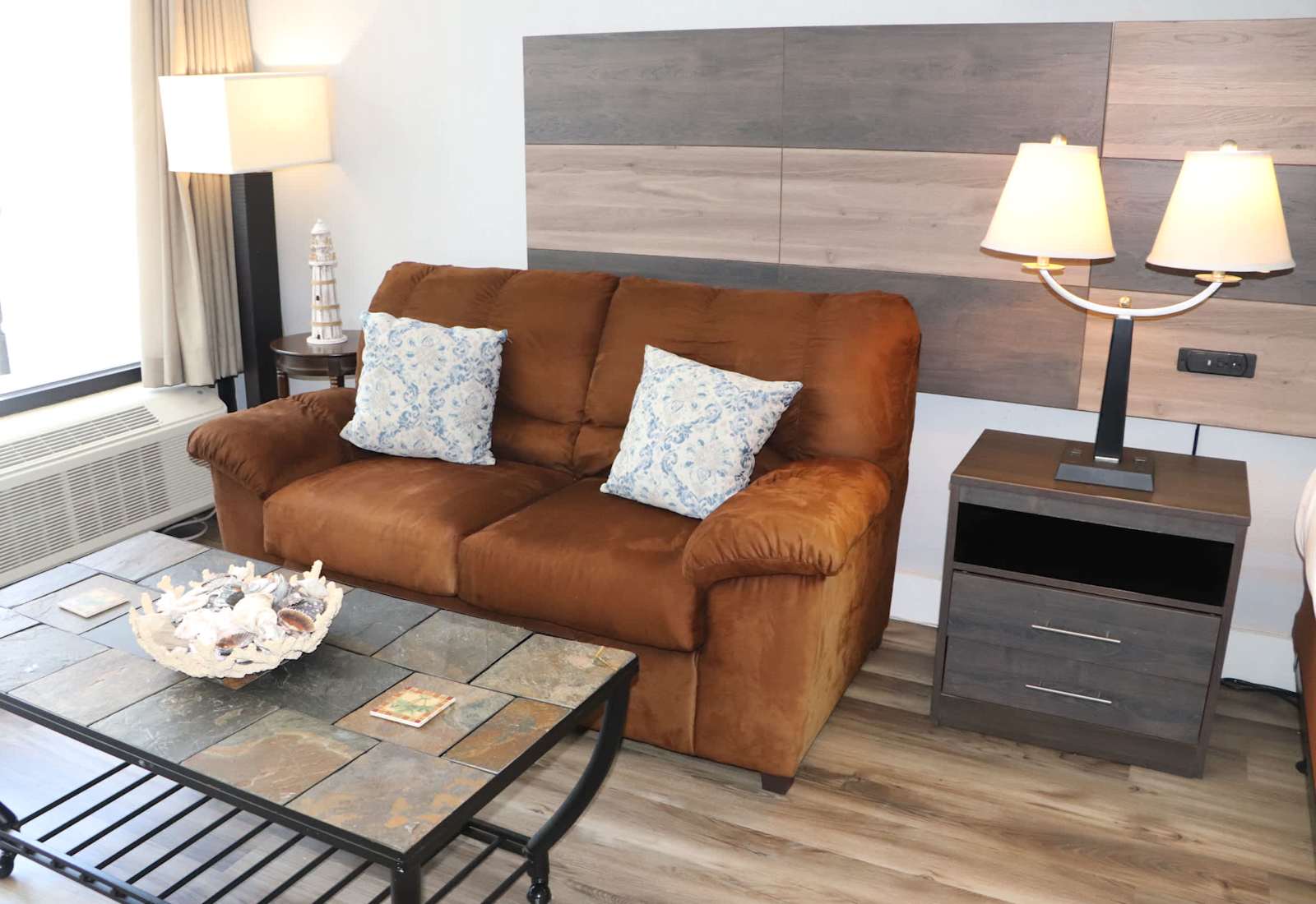 Cozy living area with comfortable seating, warm lighting, and coastal-inspired décor — a relaxing spot to unwind after a day at the beach.