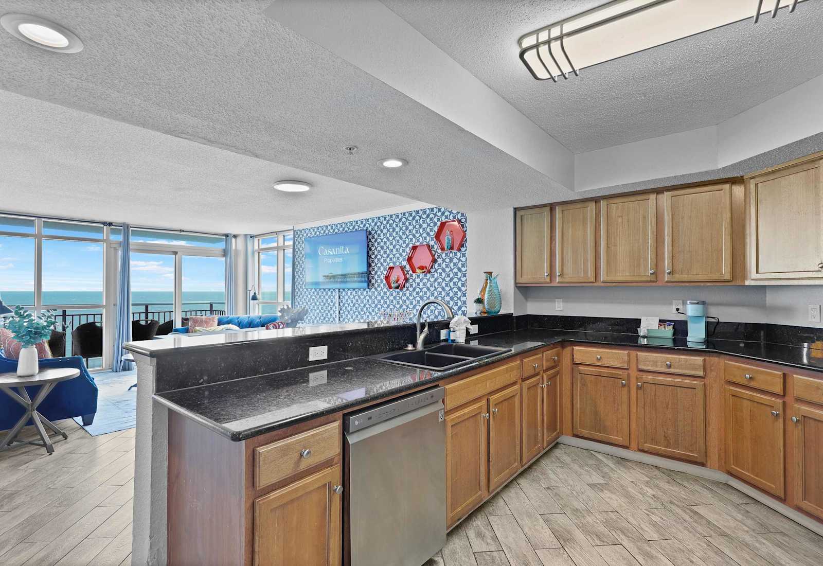 Cook with a view in this spacious, fully equipped kitchen featuring granite countertops, modern appliances, and stunning ocean views. Perfect for whipping up meals while enjoying your Myrtle Beach beachfront escape!