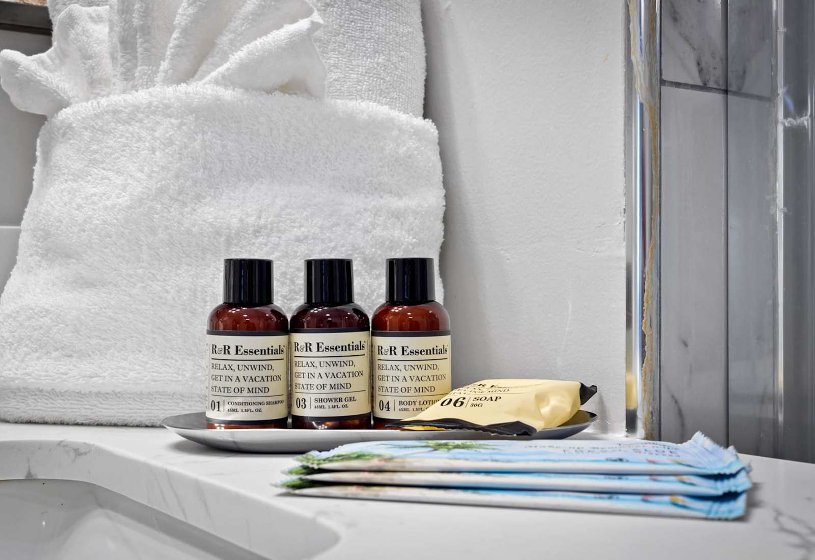 Pamper yourself with our R&R Essentials toiletries, expertly curated to enhance your relaxation. Featuring conditioning shampoo, shower gel, and more, each product promises a luxurious experience to leave you refreshed and in a perfect vacation state