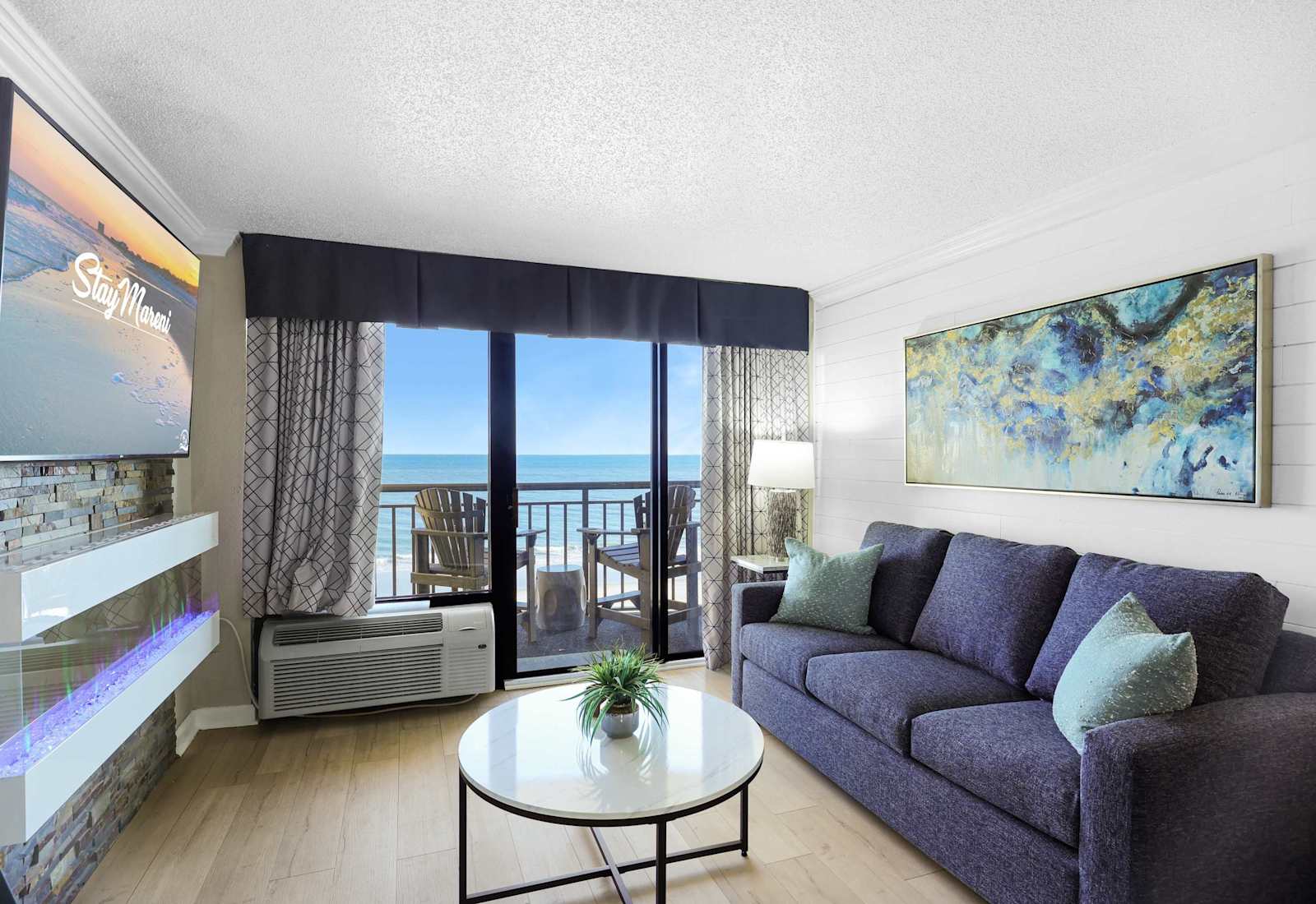 Bright, modern, and oceanfront—this inviting living space features a sleek electric fireplace, private balcony, and all the comforts of home. Ideal for a romantic escape or a fun-filled beach getaway.