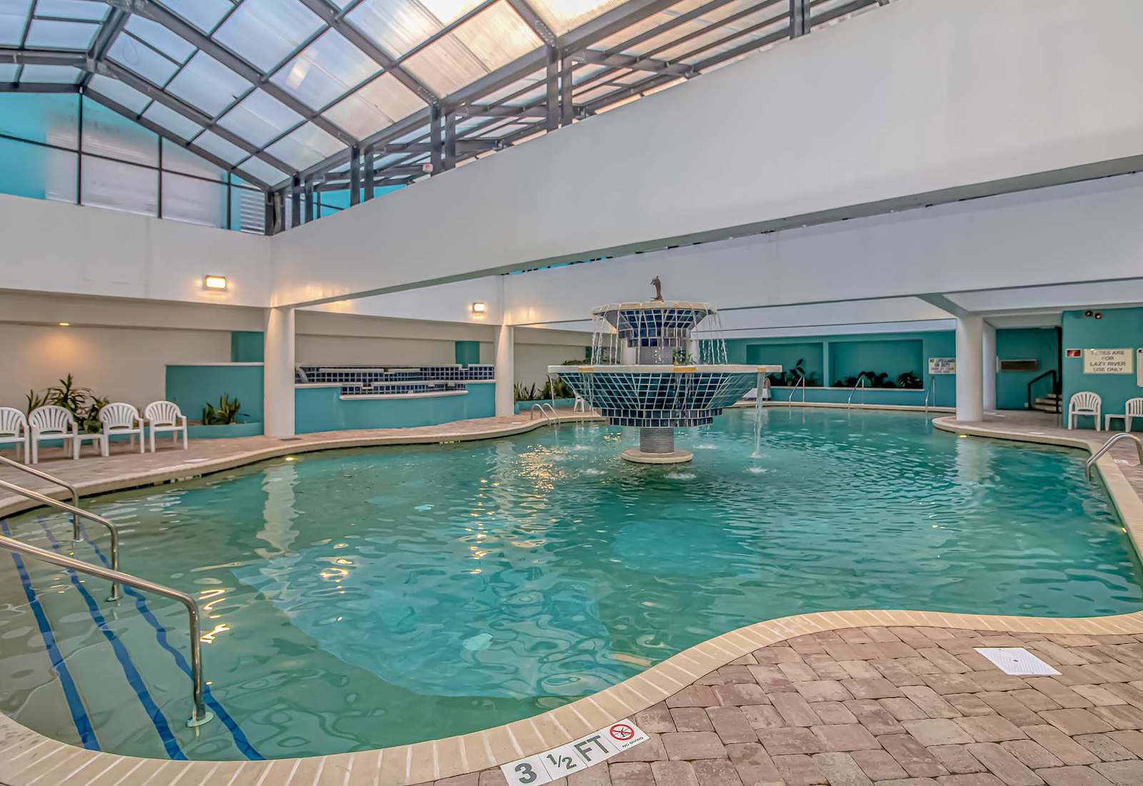 Indoor resort pool with plenty of space to swim, lounge, and enjoy a relaxing break during your Myrtle Beach stay.
