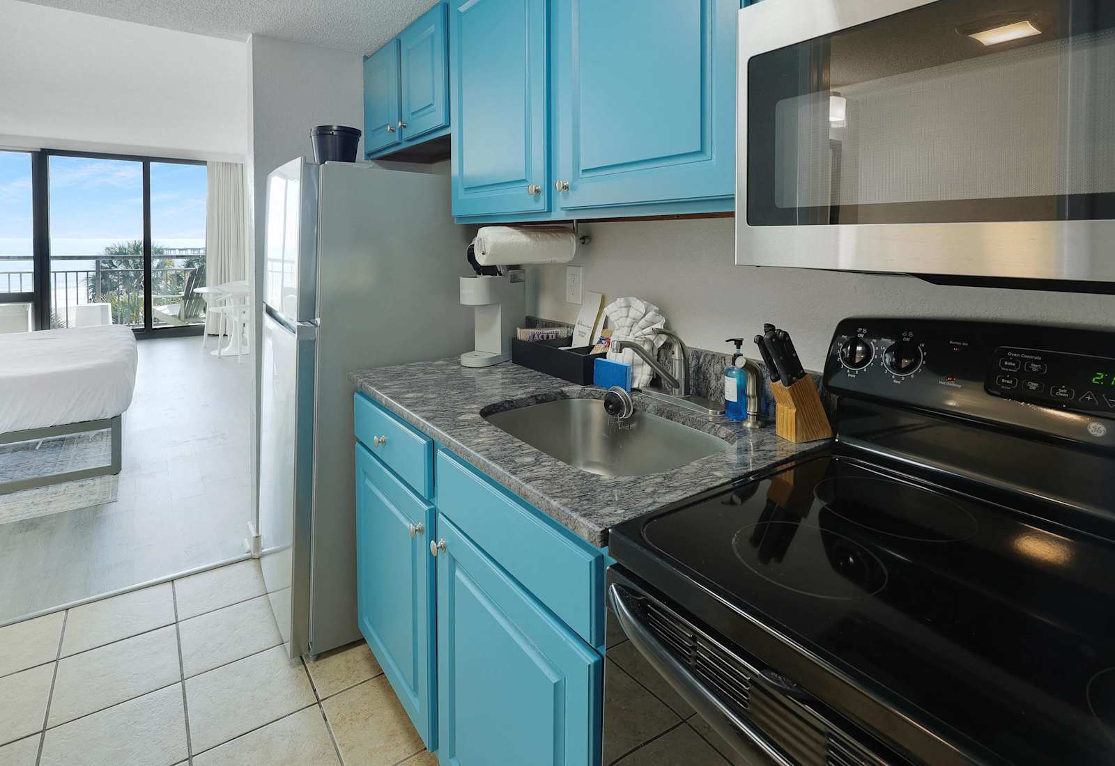 Enjoy the convenience of a full kitchen with everything you need to cook up your favorites. With ocean views just steps away, this space makes dining in as delightful as heading out. Perfect for extended stays or cozy beachside meals.