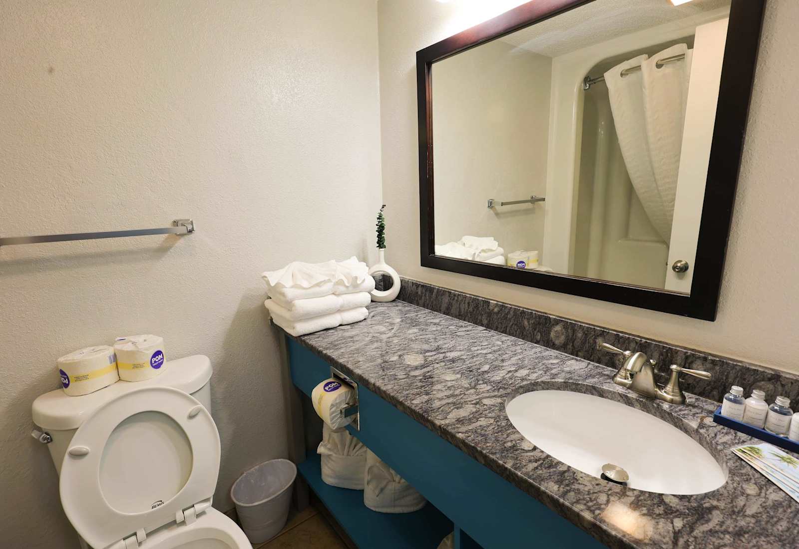 Fresh, clean, and thoughtfully stocked, this bathroom offers plush towels, a spacious granite vanity, and a tub-shower combo—everything you need to refresh after a day of sun, sand, and seaside fun.